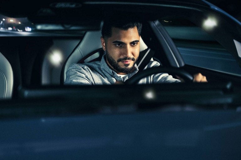 Person sitting in the driver’s seat of a parked 2024 Ford Mustang® coupe | Banister Ford of Marlow Heights in Suitland MD